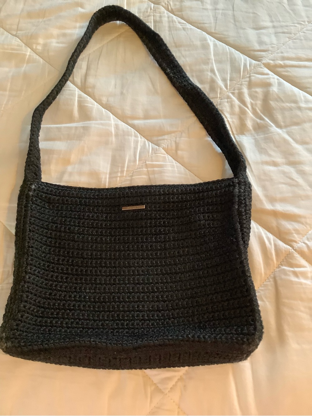 The Sak Black Crochet Shoulder Bag with Metal Logo